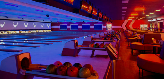 Ball return with bowling balls looking out to the lanes