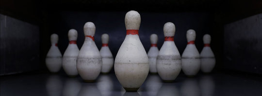 duckpin bowling pins set up in a triangle