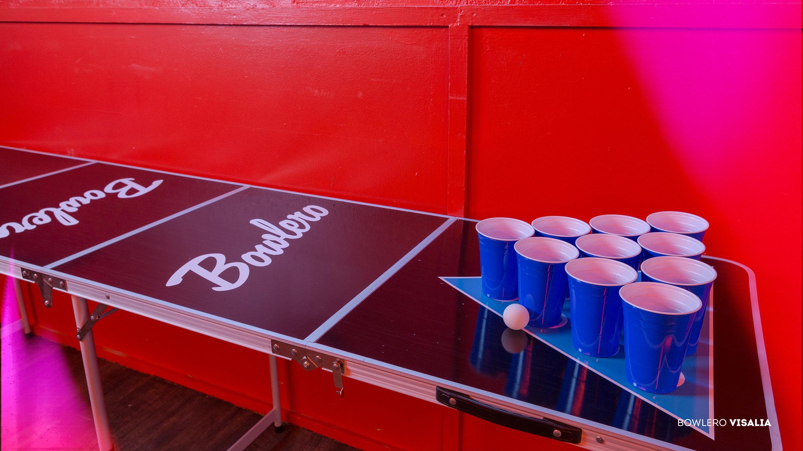 Bowlero beer pong table with blue cups