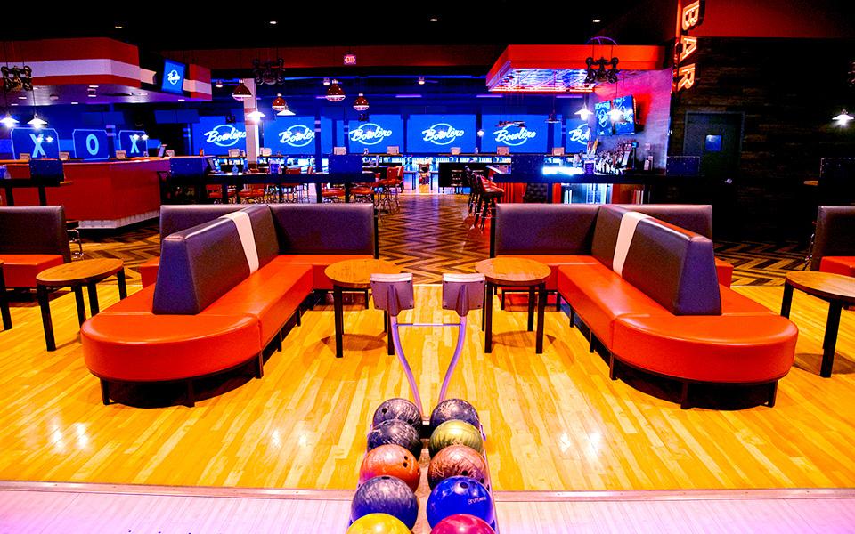 Comfortable bowling lane seating with bowling center in background