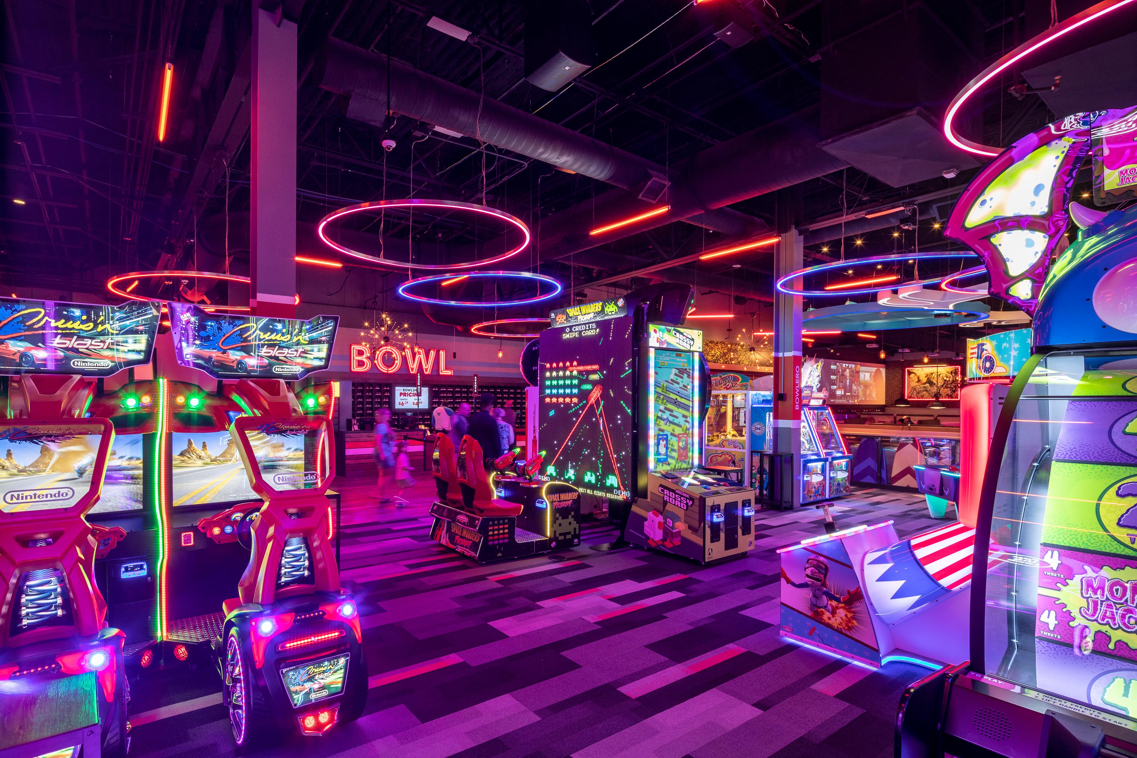 Arcade games at Bowlero Dania Beach with neon lights. 