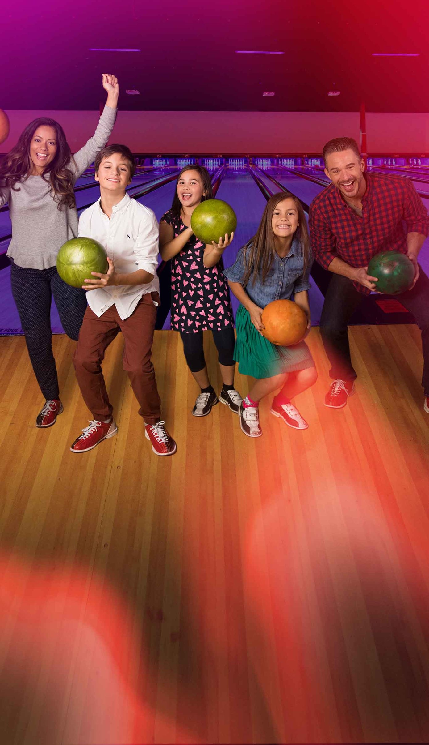 Family On The Lanes Holding Bowling